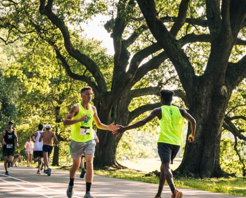 two residents encouraging each other to finish the race with a high five