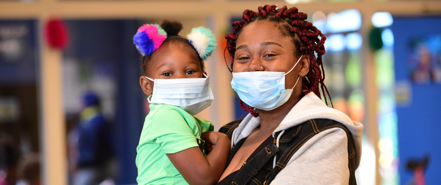 Woman and child wearings masks