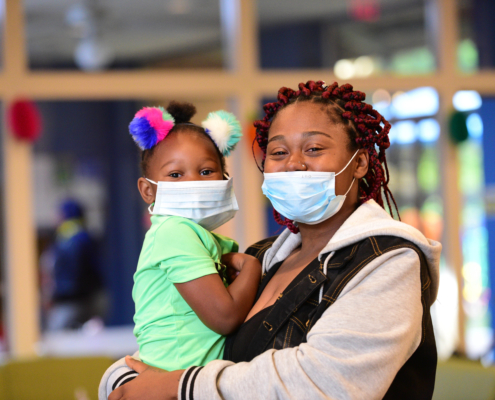 Woman and child wearings masks