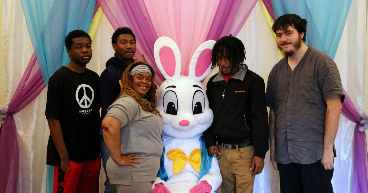 The Easter Bunny poses with some youth