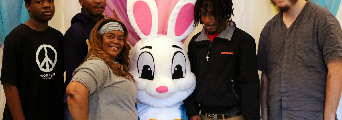 The Easer Bunny poses with some youth