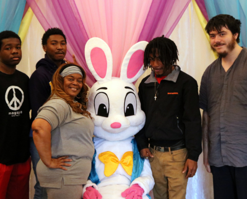 The Easer Bunny poses with some youth