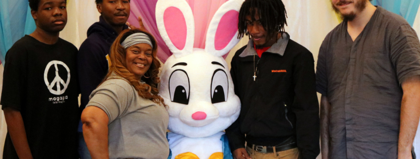The Easer Bunny poses with some youth