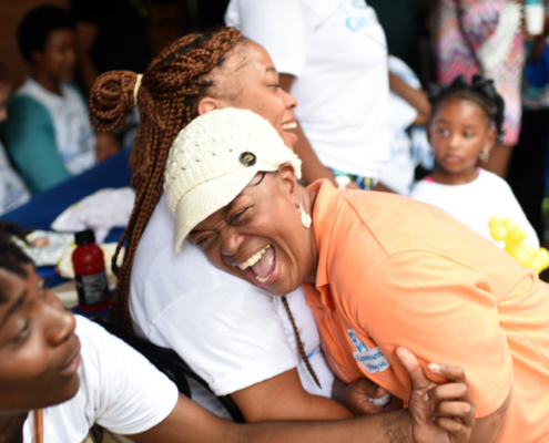 Mama Foots laughing with others