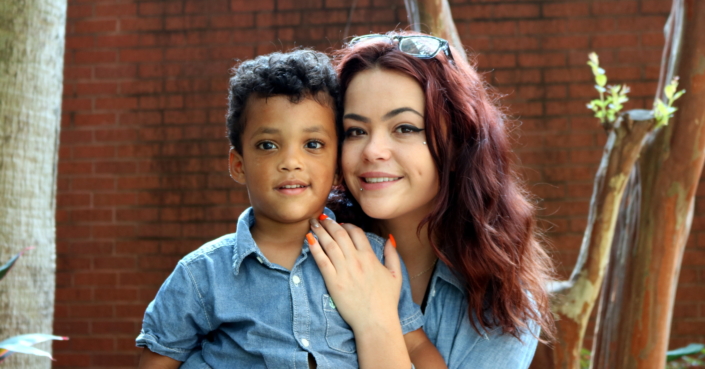 Woman and child pose for a photo