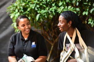 Deneen Jackson smiles with another Covenant House employee during Sleep Out 2020