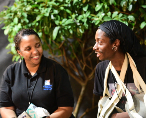 Deneen Jackson smiles with another Covenant House employee during Sleep Out 2020