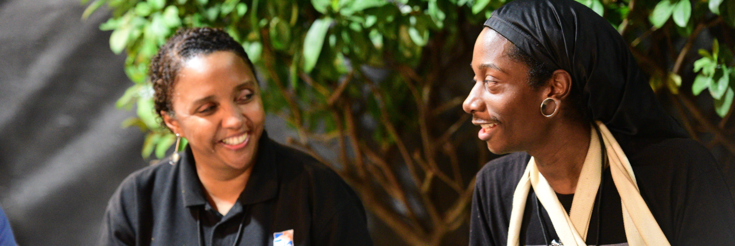 Deneen Jackson smiles with another Covenant House employee during Sleep Out 2020