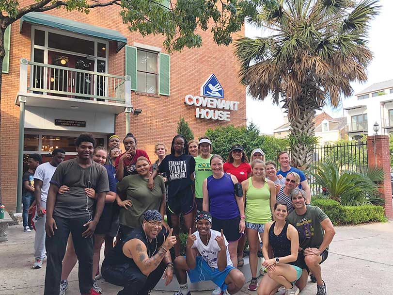 Covenant House New Orleans homeless youth in front of homeless shelter