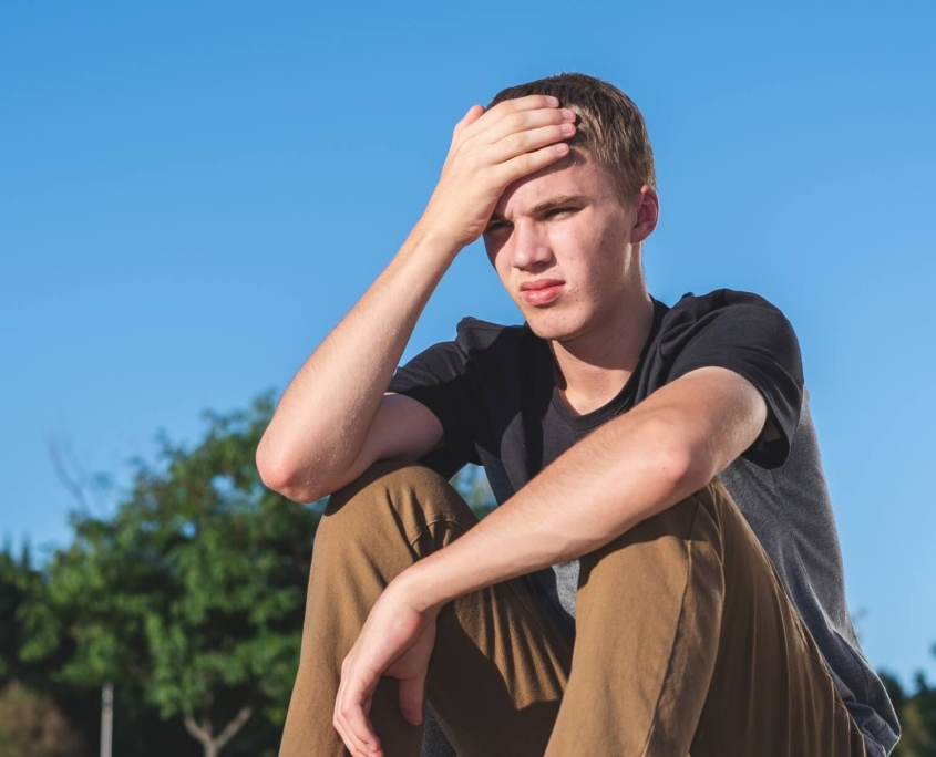 July Budget Veto Donation Image-final homeless young person sitting outside | Covenant House - Donate to support youth facing homelessness.